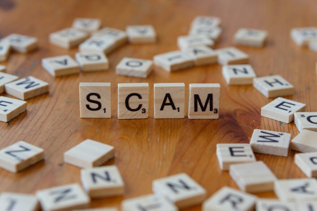 image of scrabble tiles spelling "scam" to illustrate protective trademark attorney services in Irvine, California.