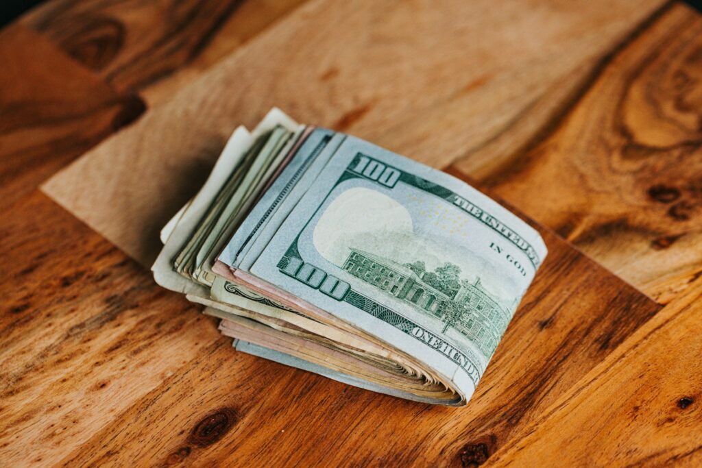 Folded up $100 bill representing patent maintenance fees and advocacy from Lapple Ubell, an IP law firm in Irvine, California.